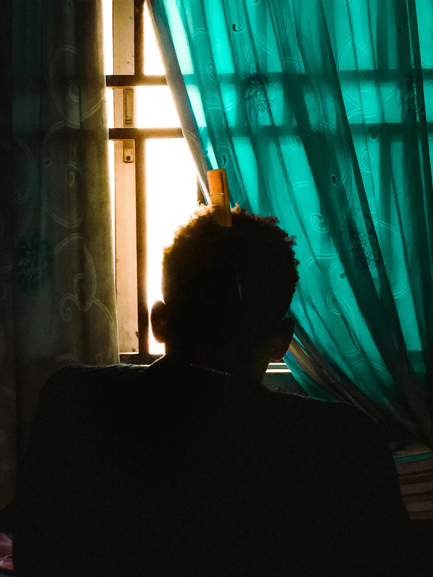 A boy looking out a window